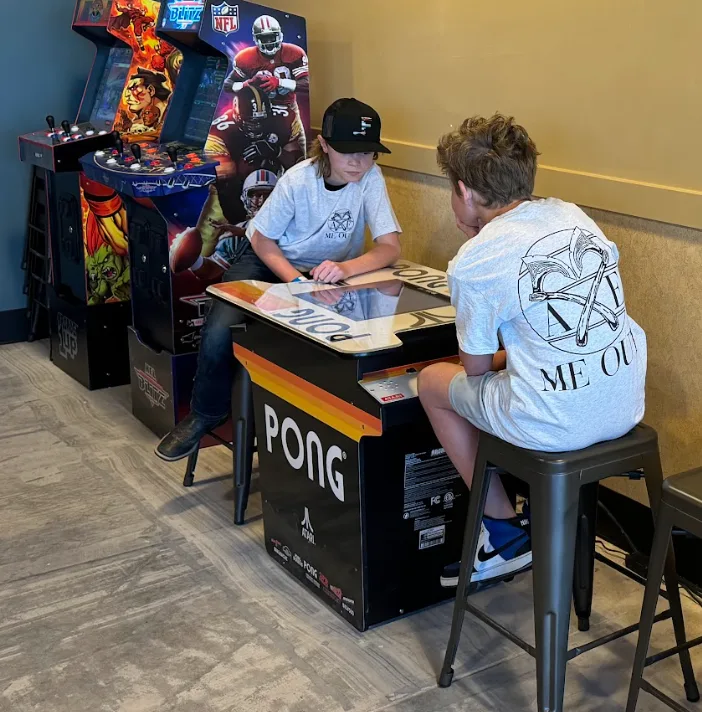 Kids arcade and axe throwing